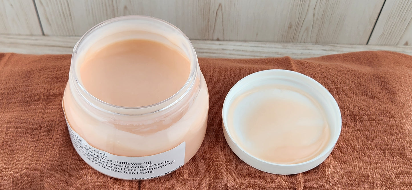 Photo of what lotion looks like inside jar: Pink, creamy lotion