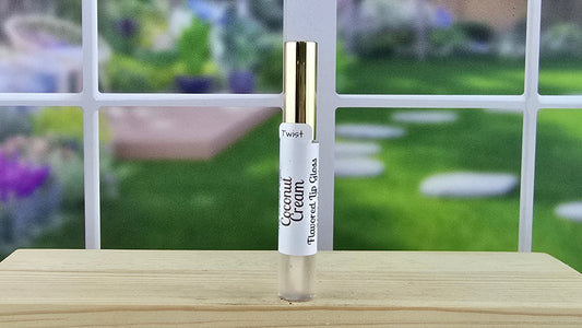 Coconut Cream flavored lip gloss single standing