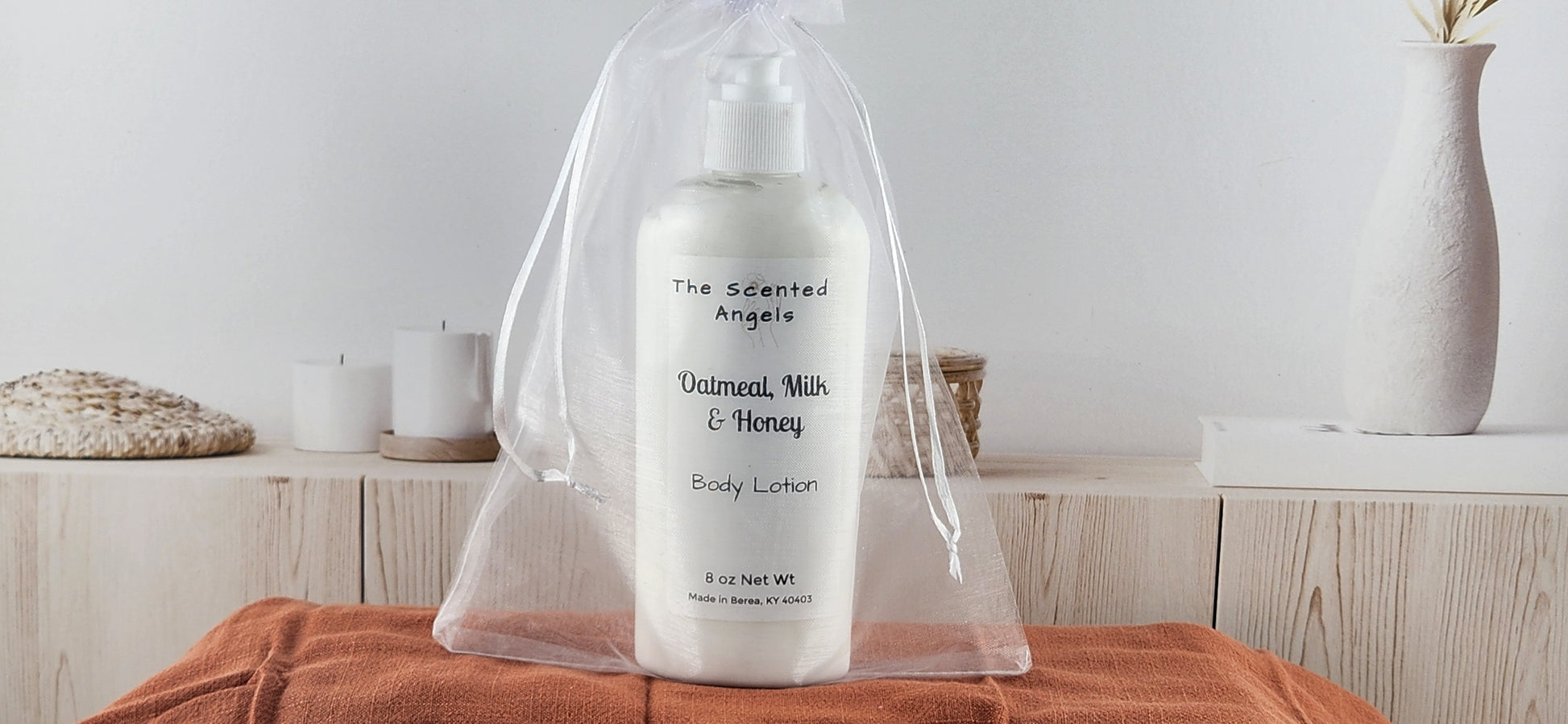 oatmeal honey body lotion front in white organza bag