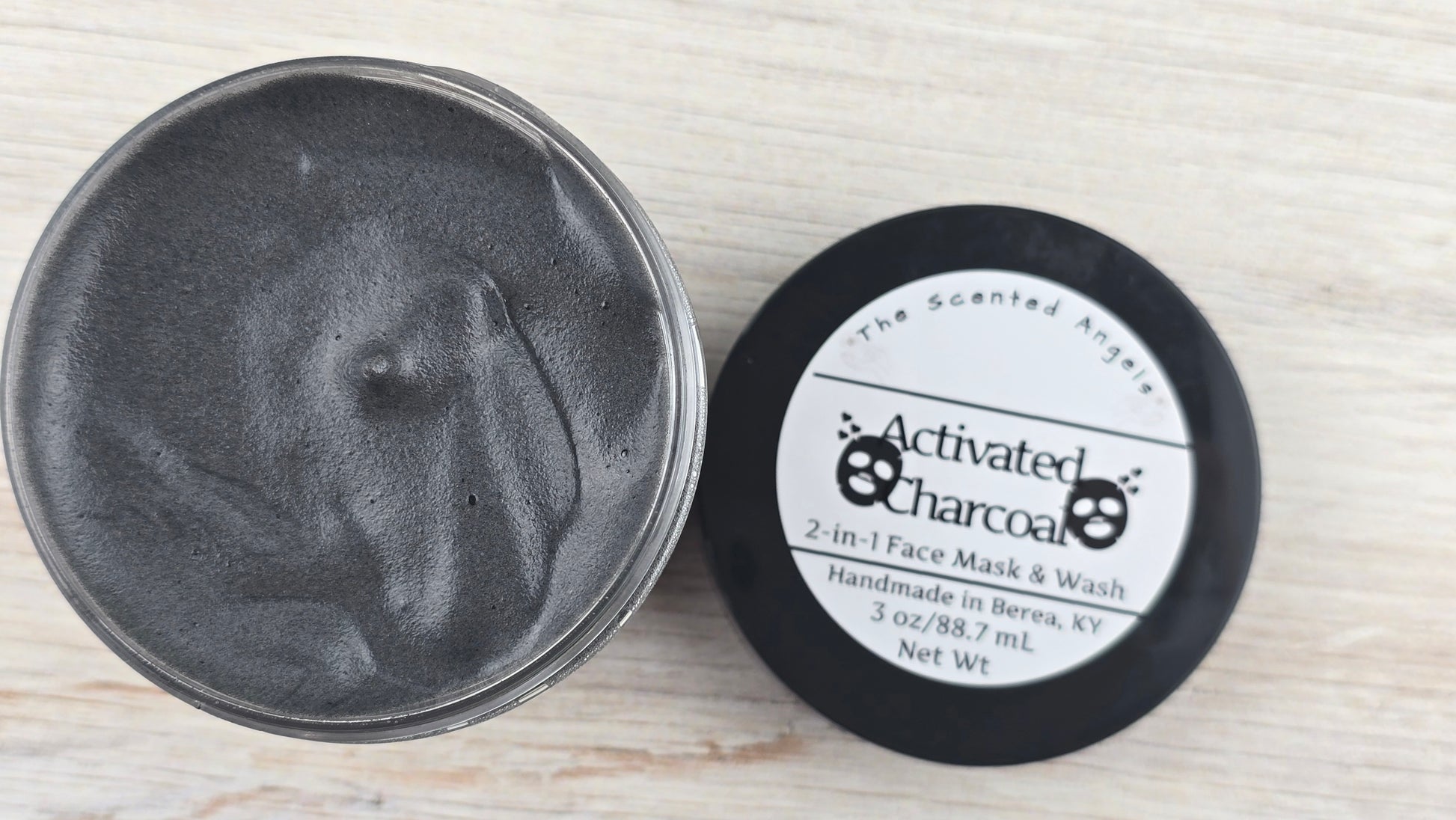 Activated Charcoal 2-in-1 Face Mask and Wash open jar top label