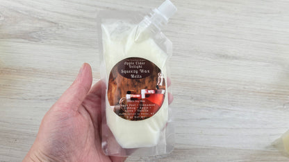 Apple Cider Delight Squeezy Wax Melts holding it in hand to show size