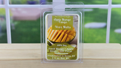 Packaged wax melts with apple and mango flavor on a wooden surface