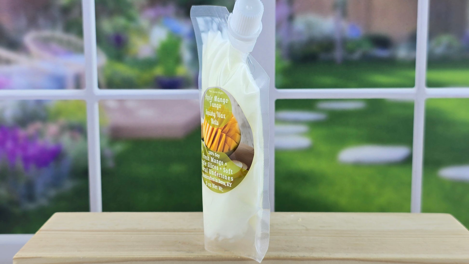 squeezable wax melt on a wooden surface
