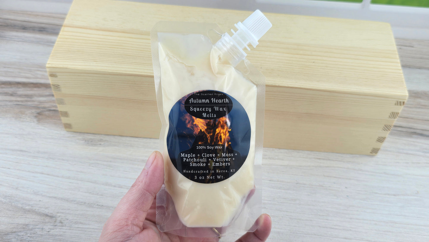 Autumn Hearth Soy Squeezy Wax Melts holding it in hand to show size of pouch