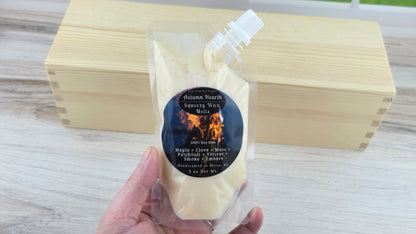 Autumn Hearth Soy Squeezy Wax Melts holding it in hand to show size of pouch