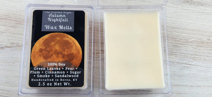 Wax melt packaging with a moon illustration and product details on a wooden surface