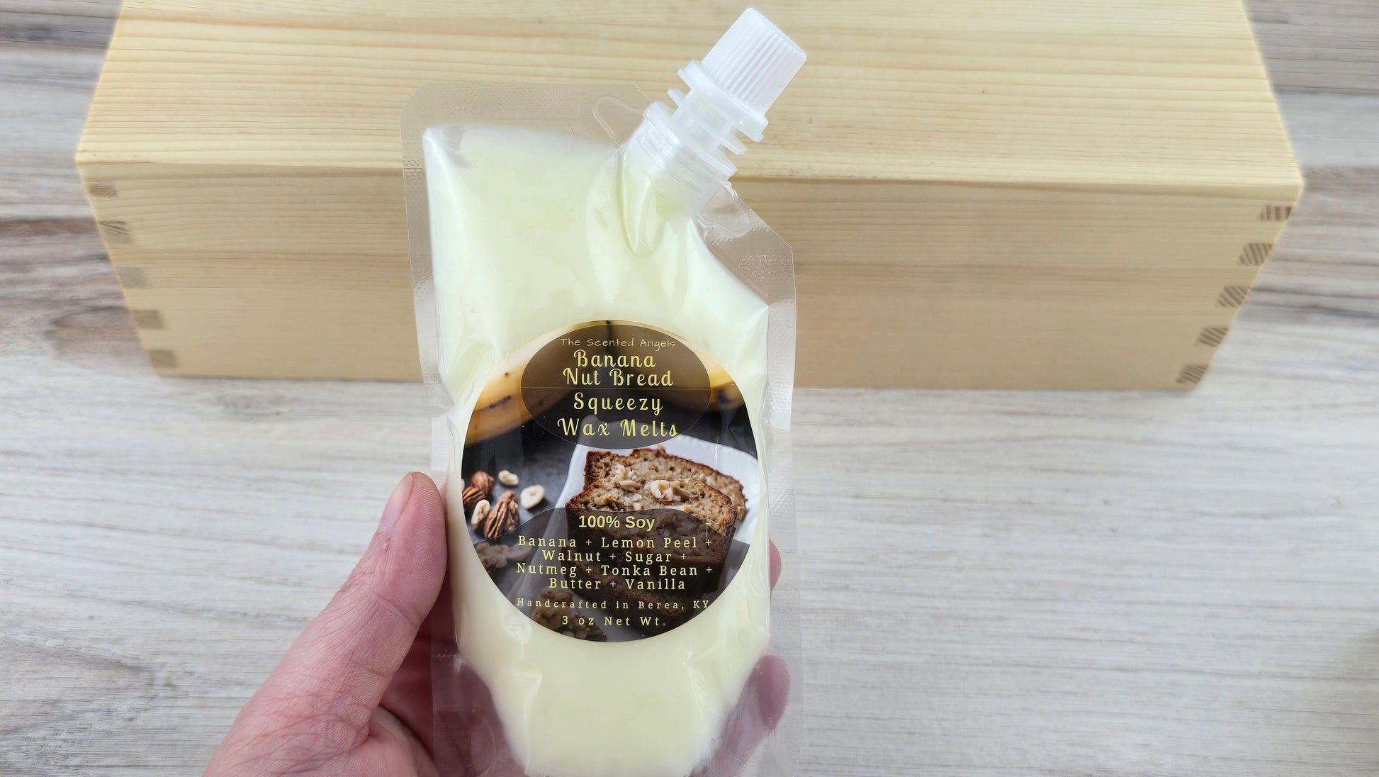 Banana Nut Bread Soy Scented Squeezy Wax Melts holding in hand to show size of pouch
