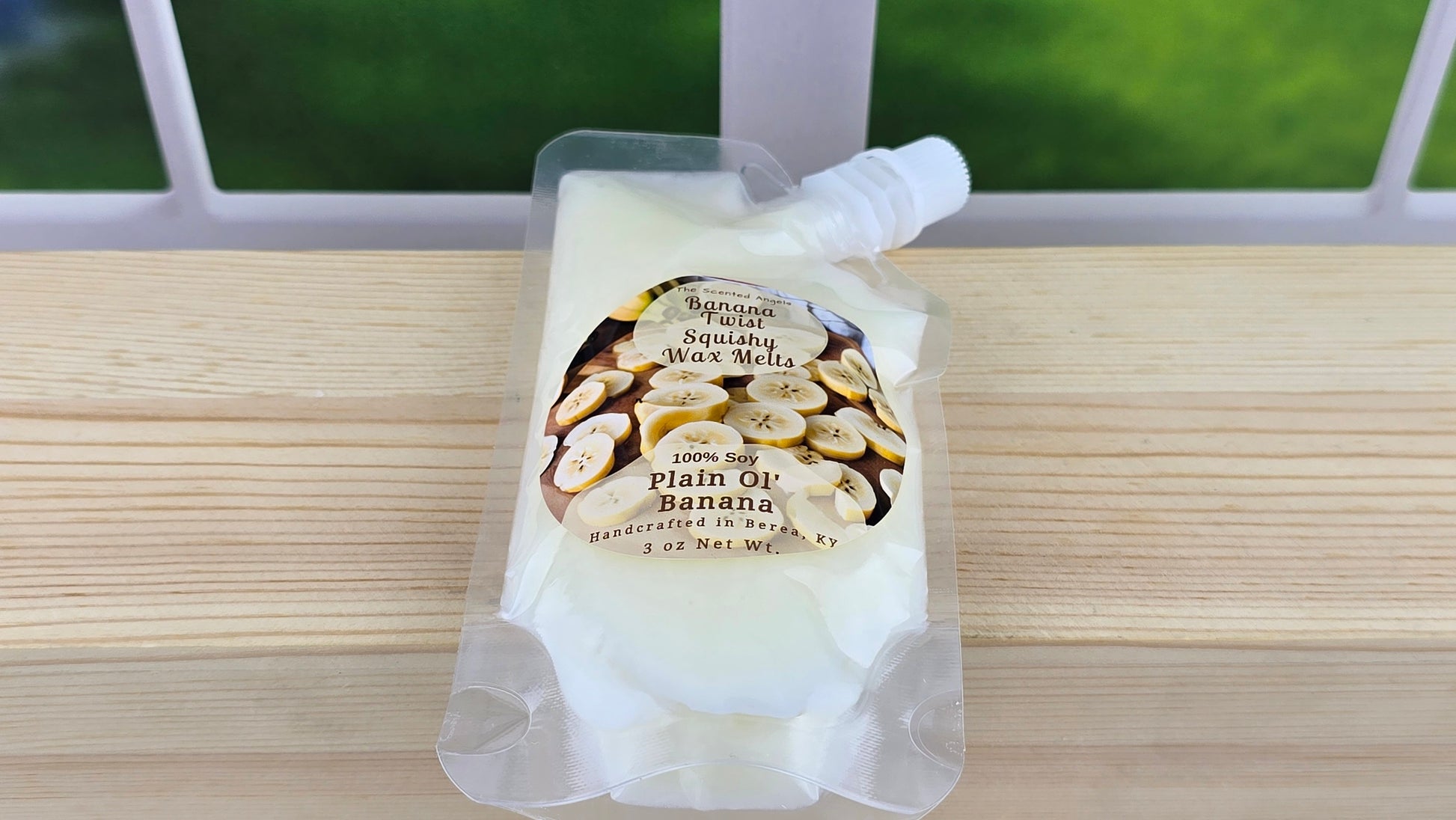 squeezable wax pouch laying on wooden surface