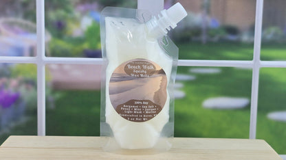 squeezable wax melt pouch 3 oz on wooden surface with blurred garden background