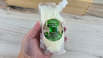 squeezable wax melt pouch held in woman's hand