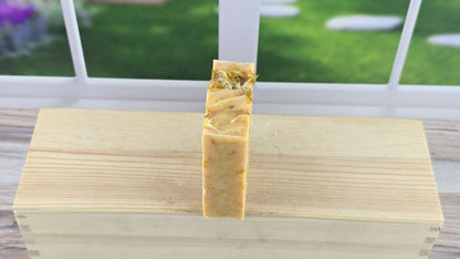 Blood Orange Dandelion Soap with a blurry background