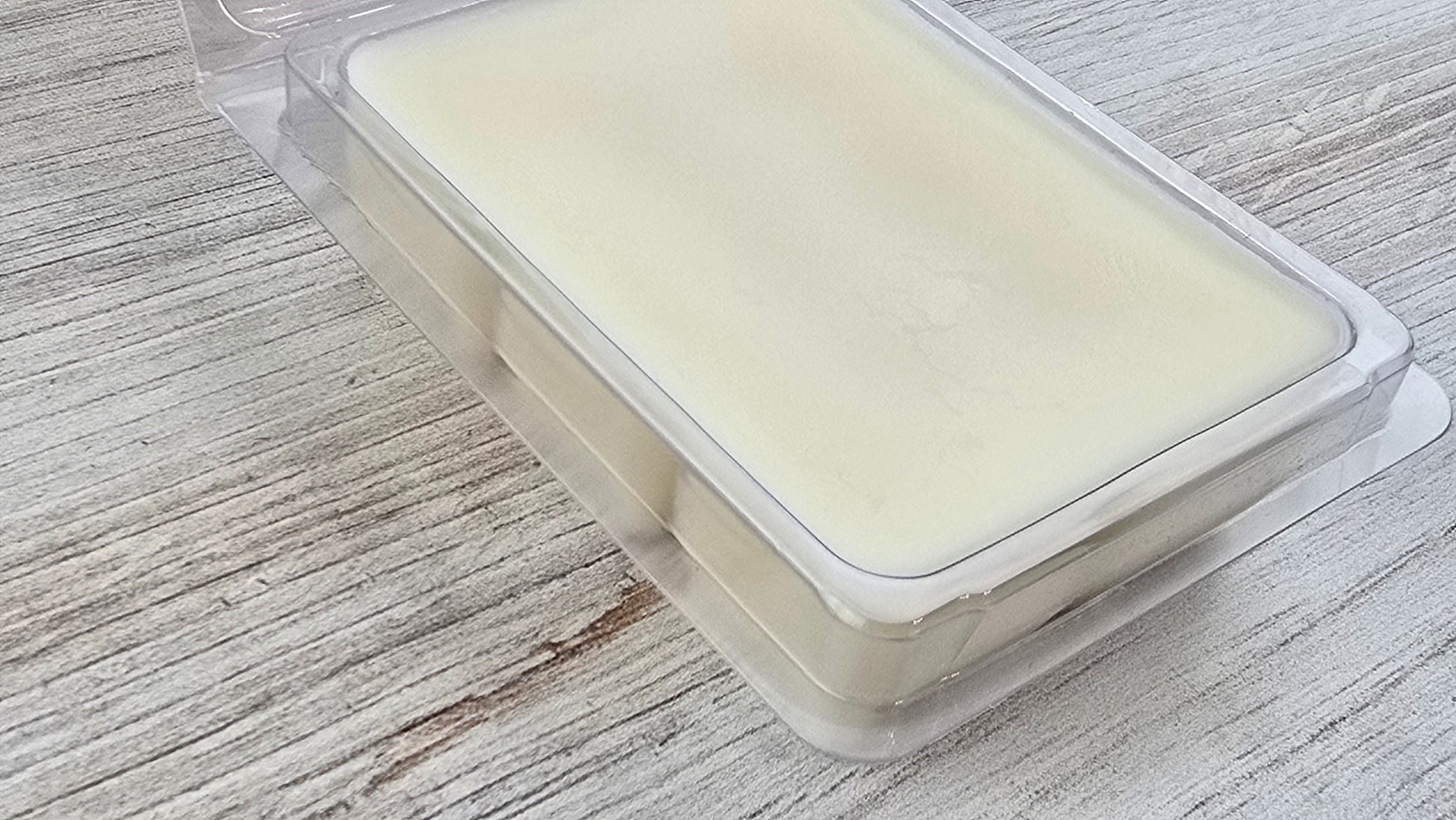 close up of butterscotch clamshell wax melt opened package