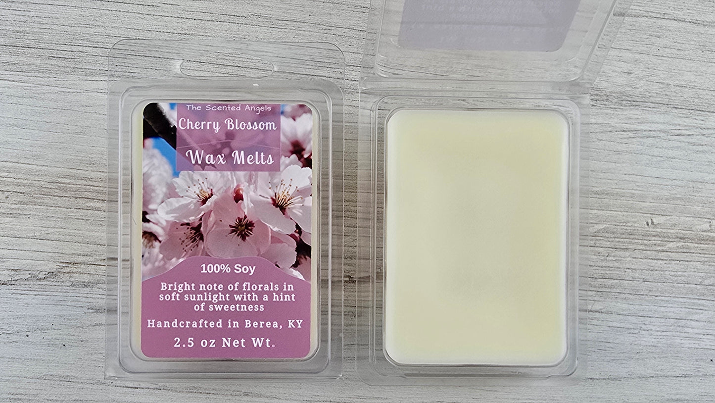Cherry blossom wax melts packaging with a pink label on a wooden surface