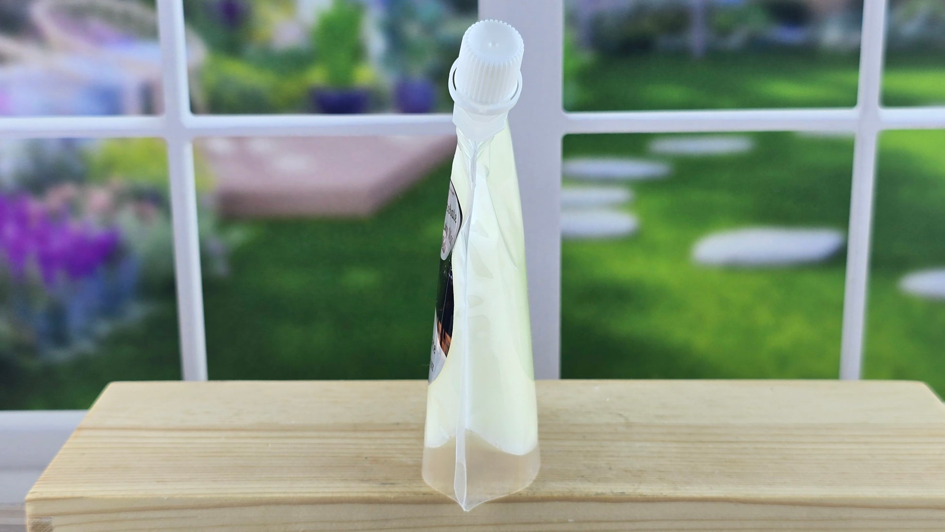 Product displayed on a wooden surface with a blurred garden background