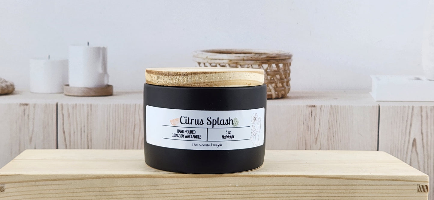 Candle labeled 'Citrus Splash' with a wooden lid on a wooden surface.