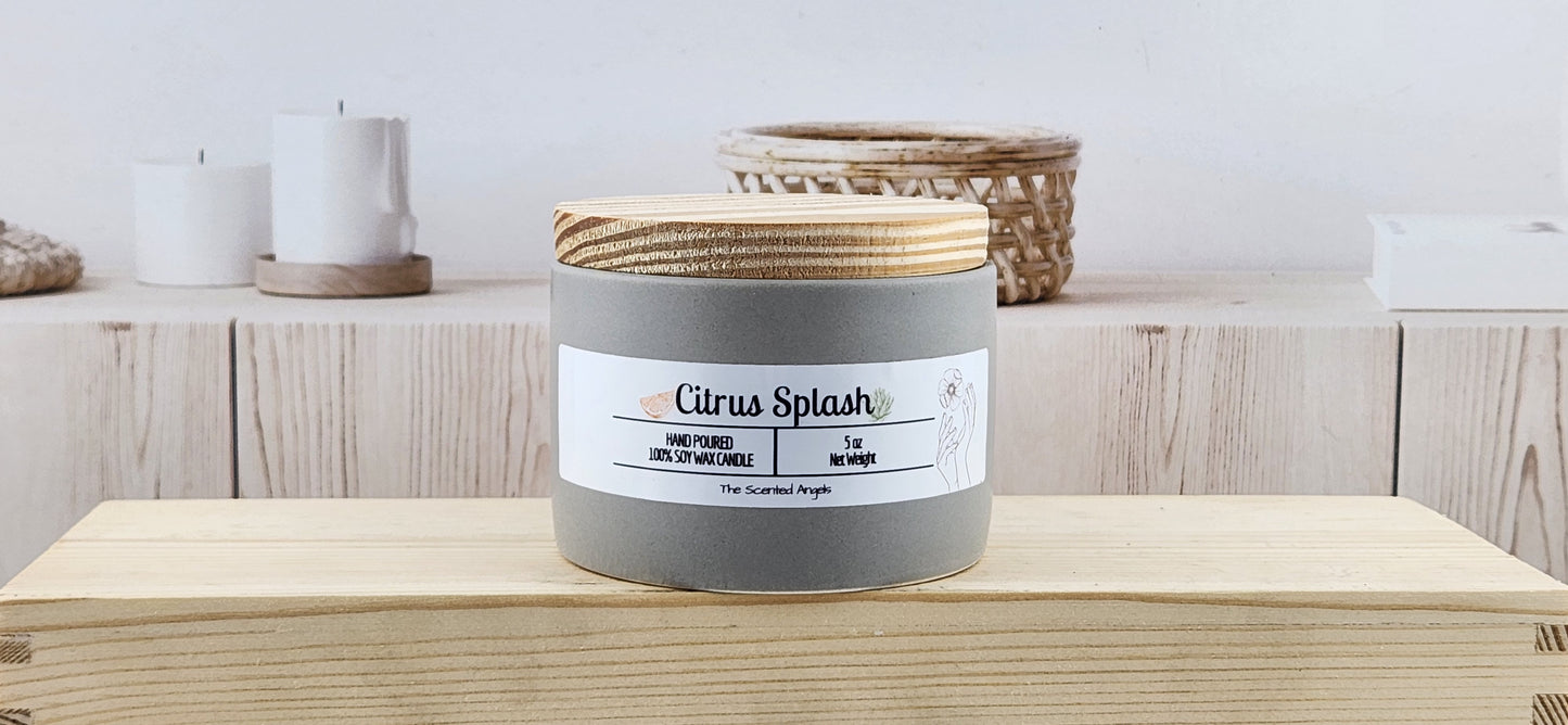Candle labeled 'Citrus Splash' on a wooden surface with a neutral background