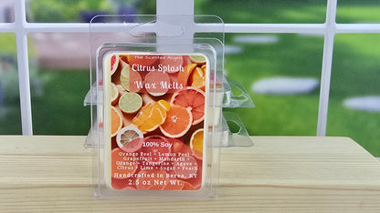 Citrus-themed wax melt package on a wooden surface with a blurred outdoor background