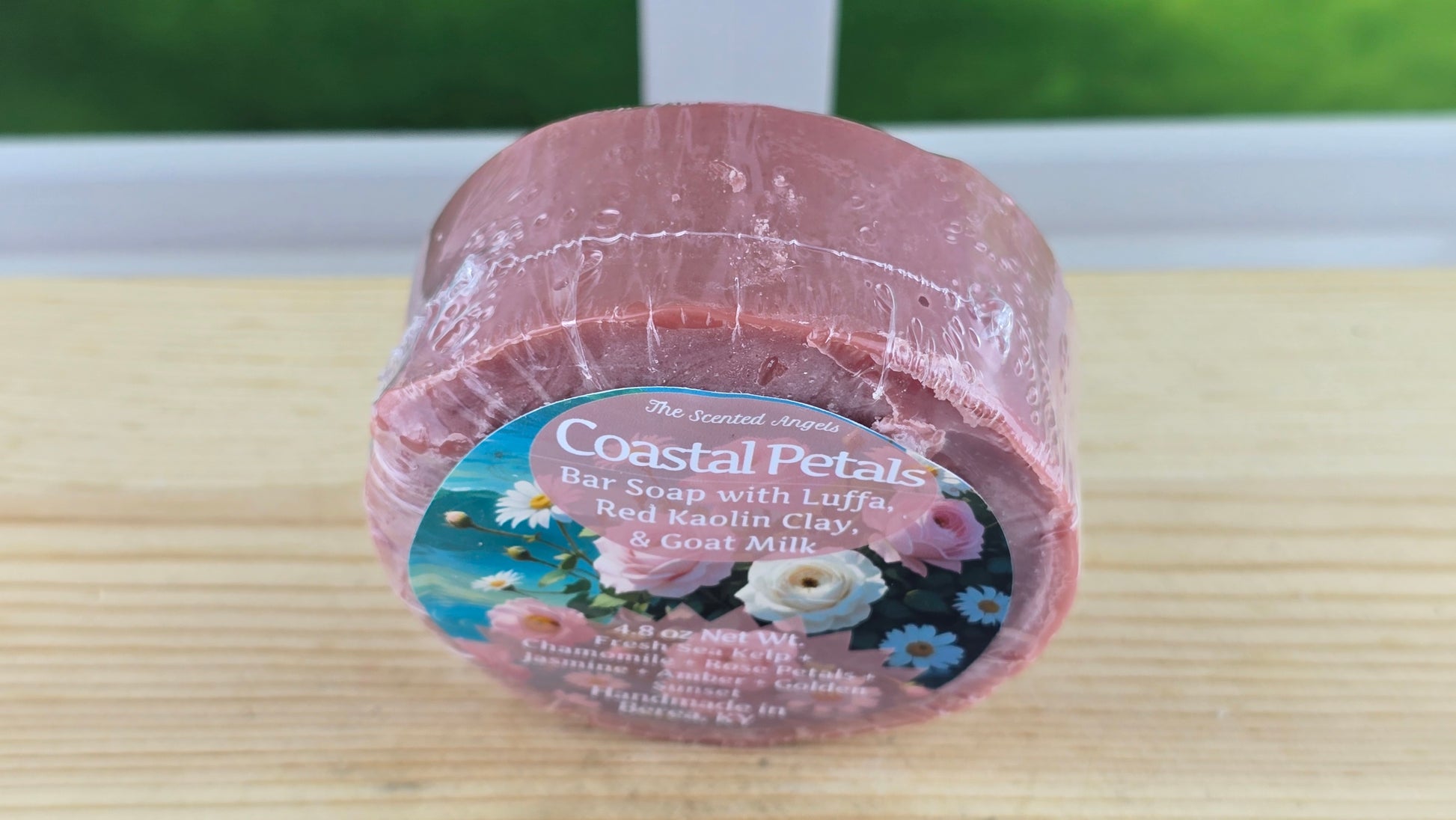 Bar of soap with a label on a wooden surface