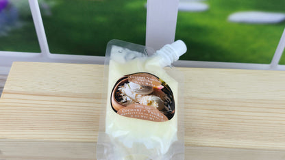 coconut vanilla wax melt squeeze pouch laying on wooden surface