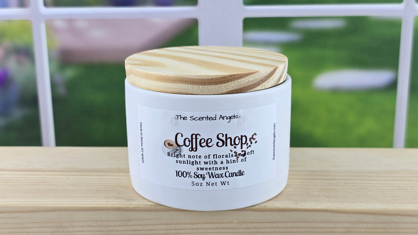 White candle container with wooden lid on a wooden surface, blurred background.