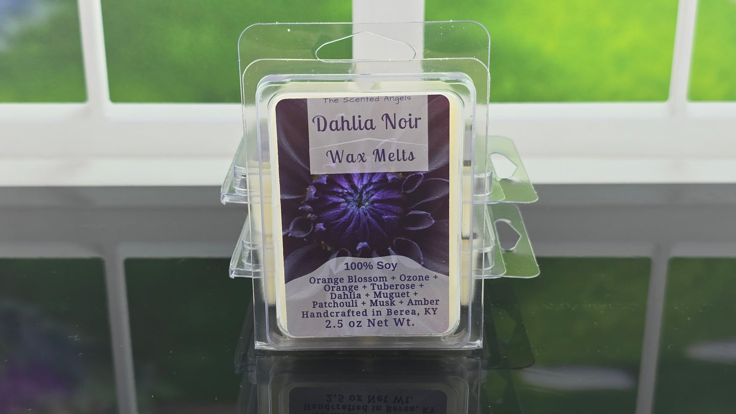 Dahlia Noir wax melts packaging with a purple label on a reflective surface.