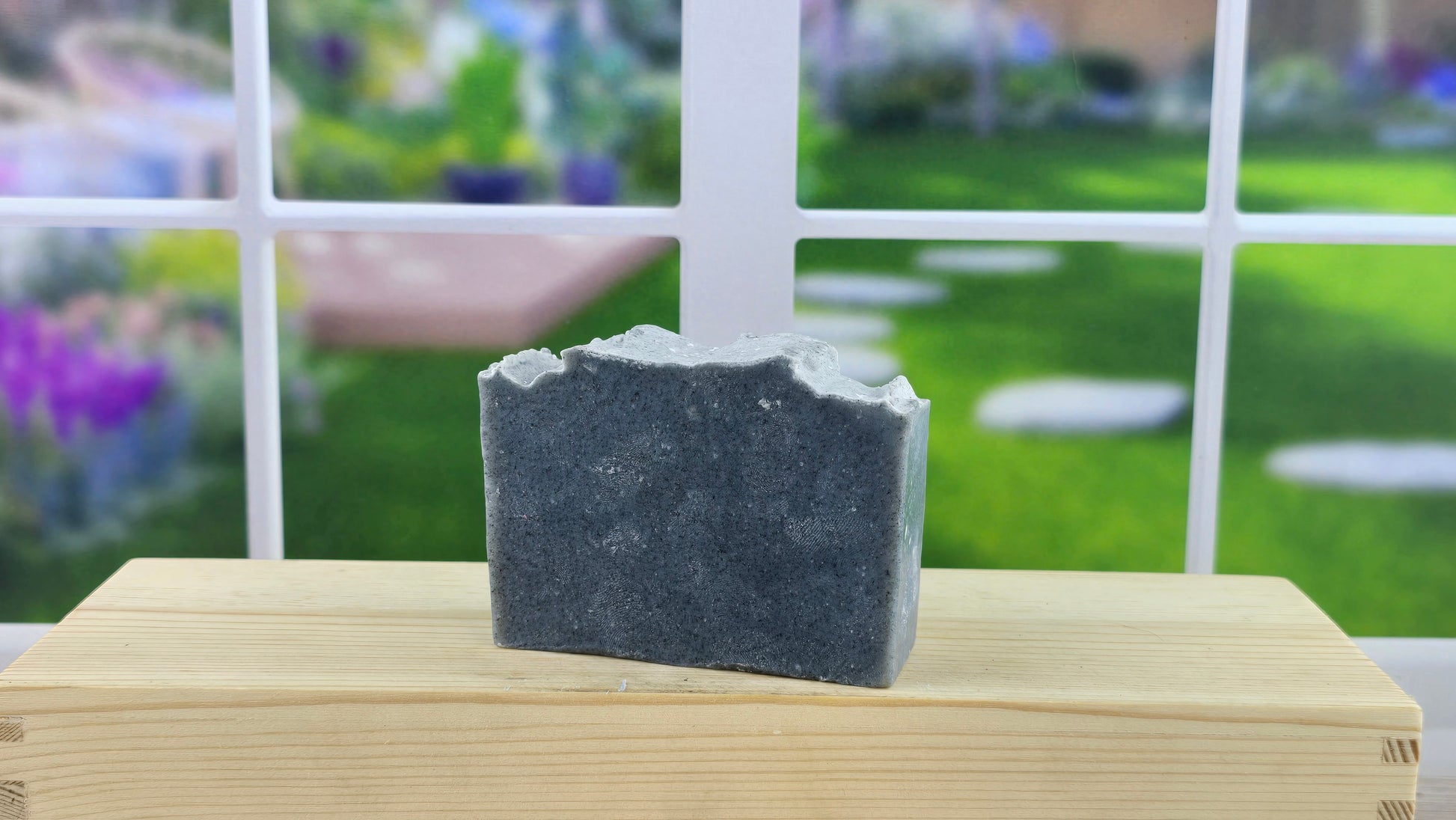 Dark Kiss soap on a wooden surface 