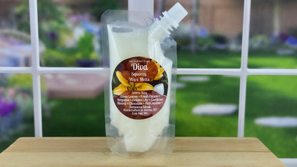 Diva-inspired handmade wax melts by The Scented Angels in clamshell and Squeeze Wax™, featuring bergamot, golden lily, gardenia, chocolate, rich amber, and sensuous musk.