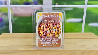 Fruity Cereal handmade wax melts by The Scented Angels in clamshell and Squeeze Wax™, featuring juicy orange, ripe berries, tangerine, and sweet sugary vanilla inspired by Fruity Pebbles.