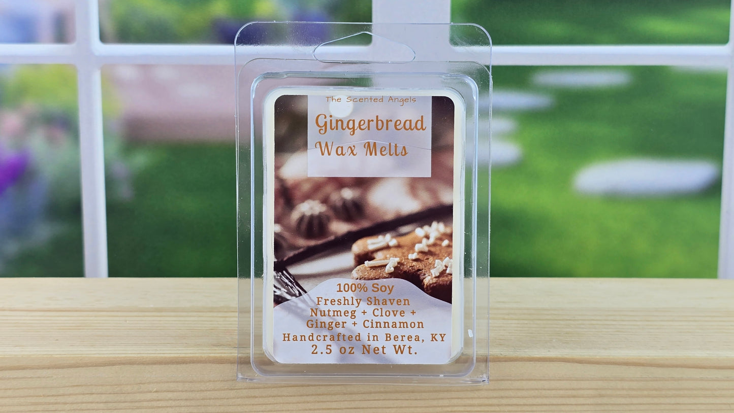 Gingerbread wax melt package on a wooden surface with a blurred outdoor background