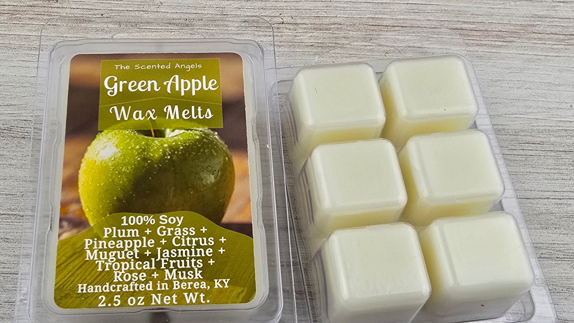 Green Apple wax melts packaging with wax melts on a wooden surface