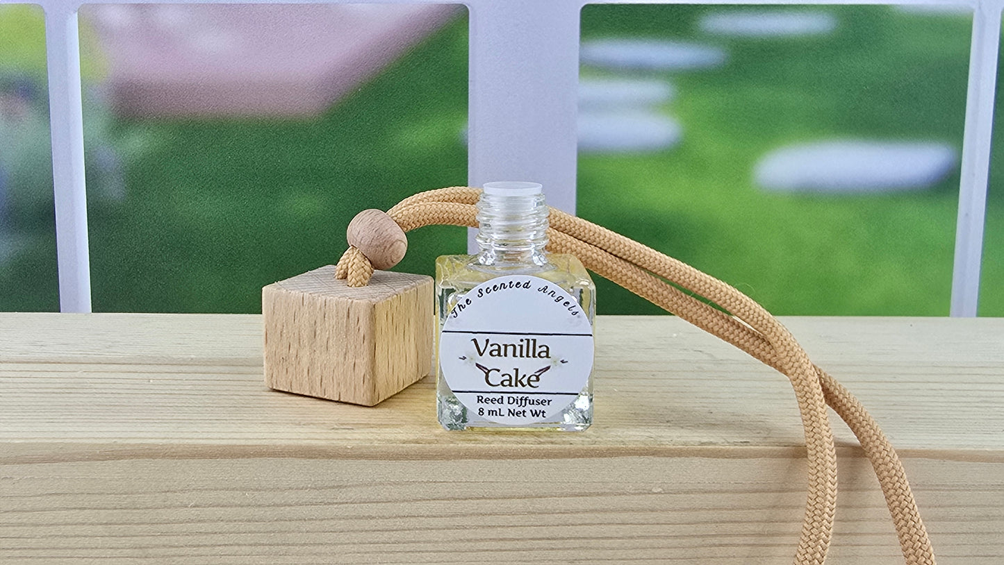 Small bottle labeled 'Vanilla Cake' with a beige rope on a wooden surface.