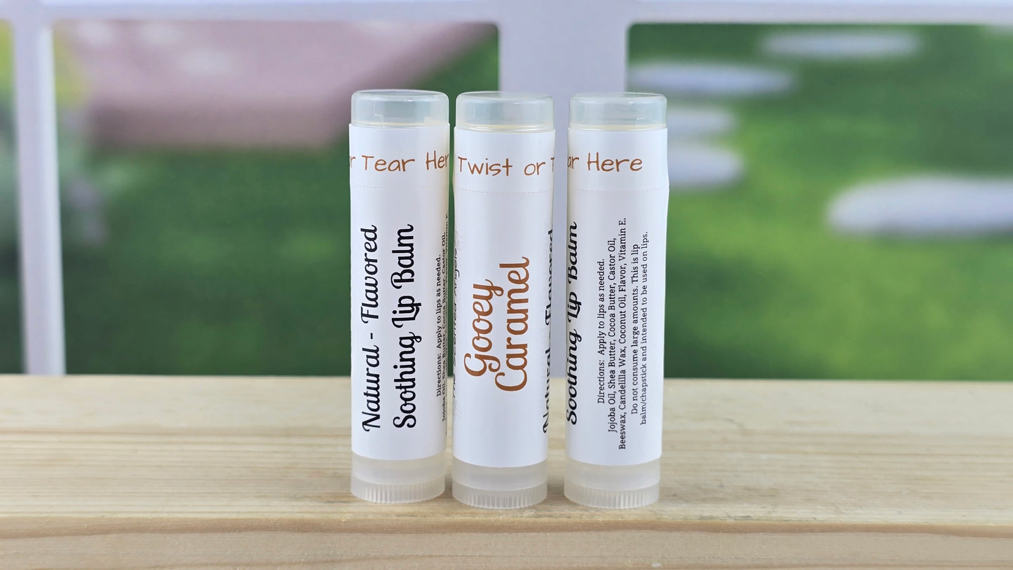  Lip balm tubes with a blurred outdoor background