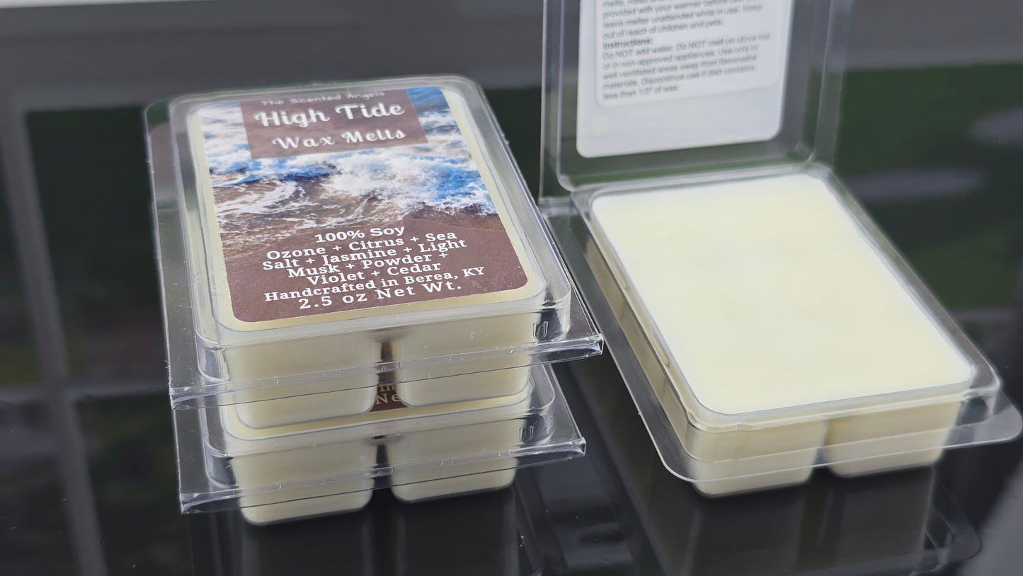 Wax melts in a clear container with a label on a dark surface