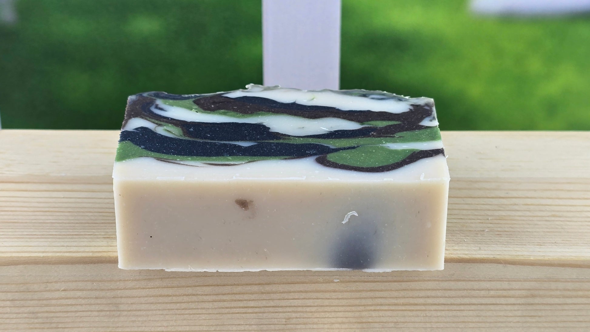 bottom view of Hunter's Love Cold Process Soap on a wooden suface