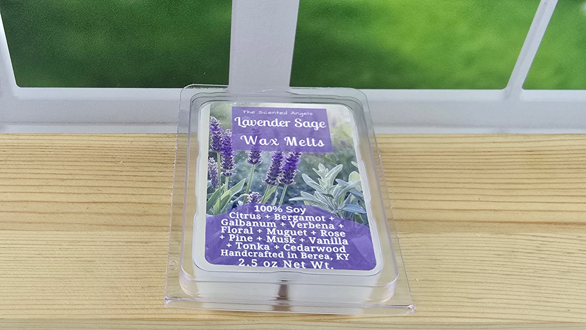 Pack of Lavender Sage wax melts on a wooden surface with a window in the background