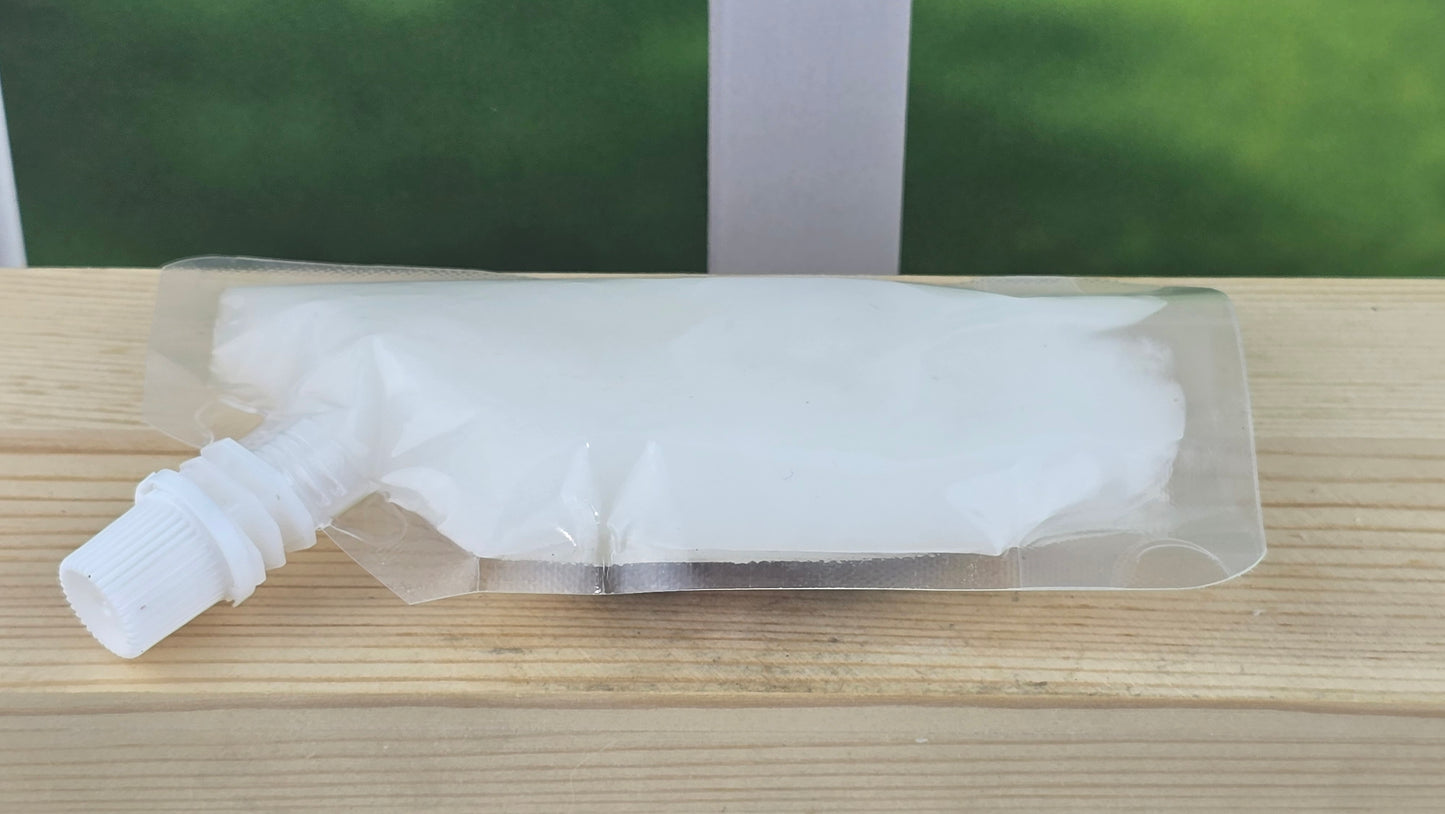 squeezy wax melt laying on wood surface