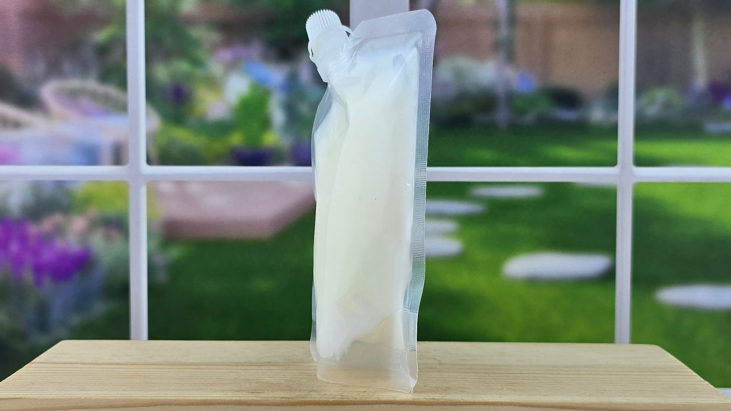squeezable wax melt pouch on wooden surface