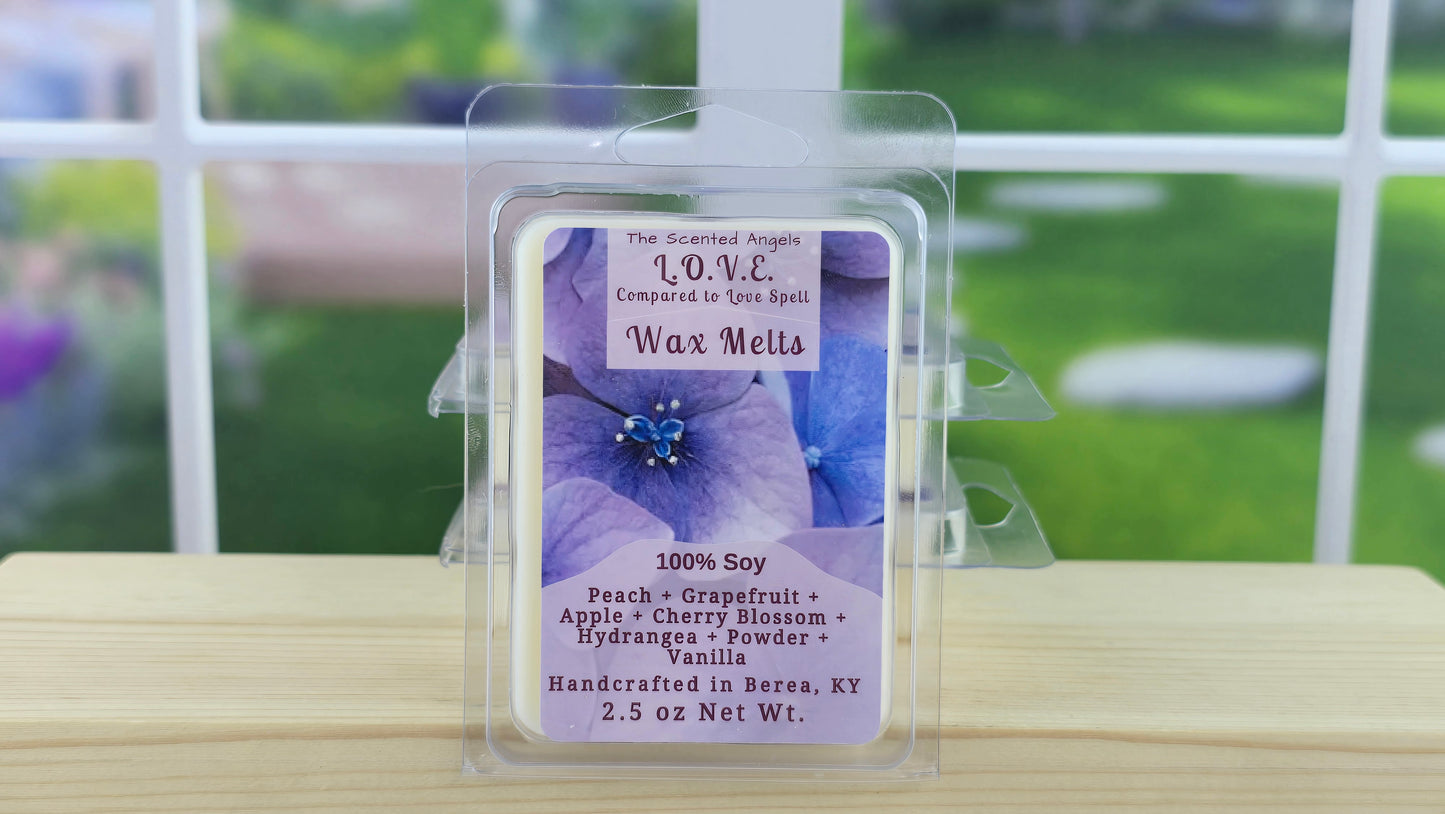Wax melt packaging with purple label featuring floral design on a wooden surface.