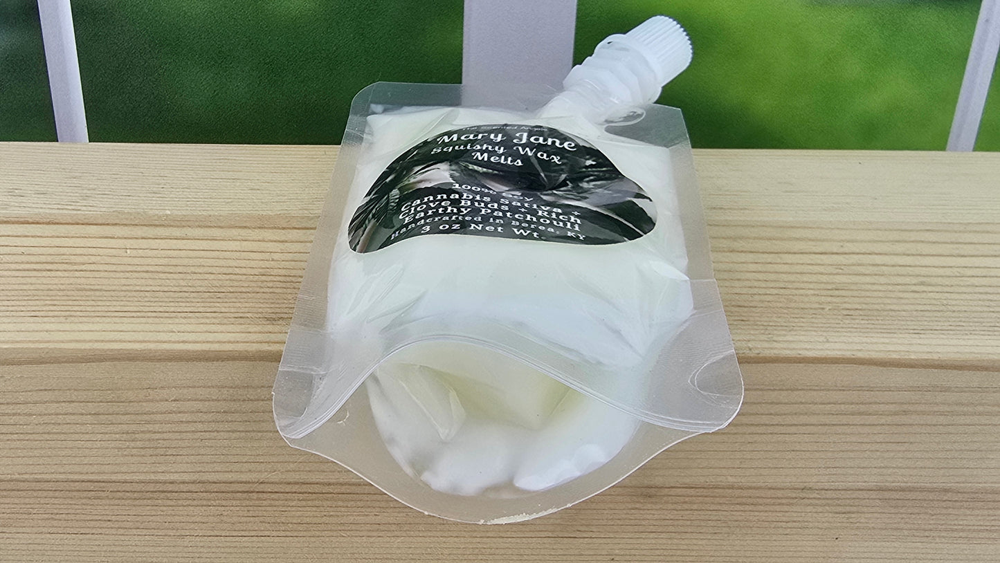 squeezable wax melt laying on wood surface