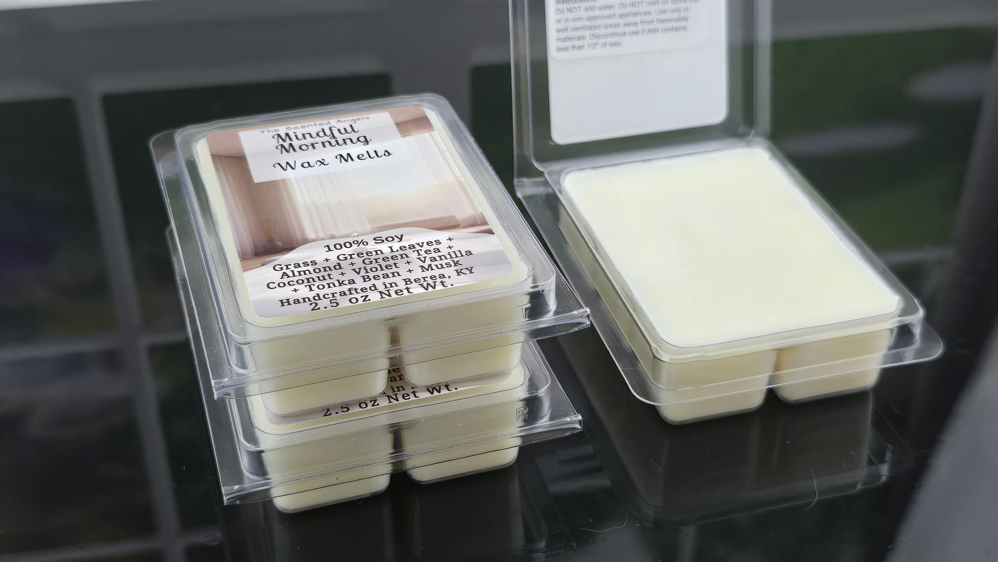 Wax melts in clear packaging with labels on a dark surface