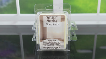 Packaged wax melts labeled 'Mindful Morning' with a window in the background