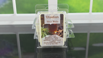 Obsidian wax melts packaging with a windowed background