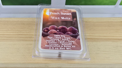 Peach Sunset Wax Melts packaging on a wooden surface