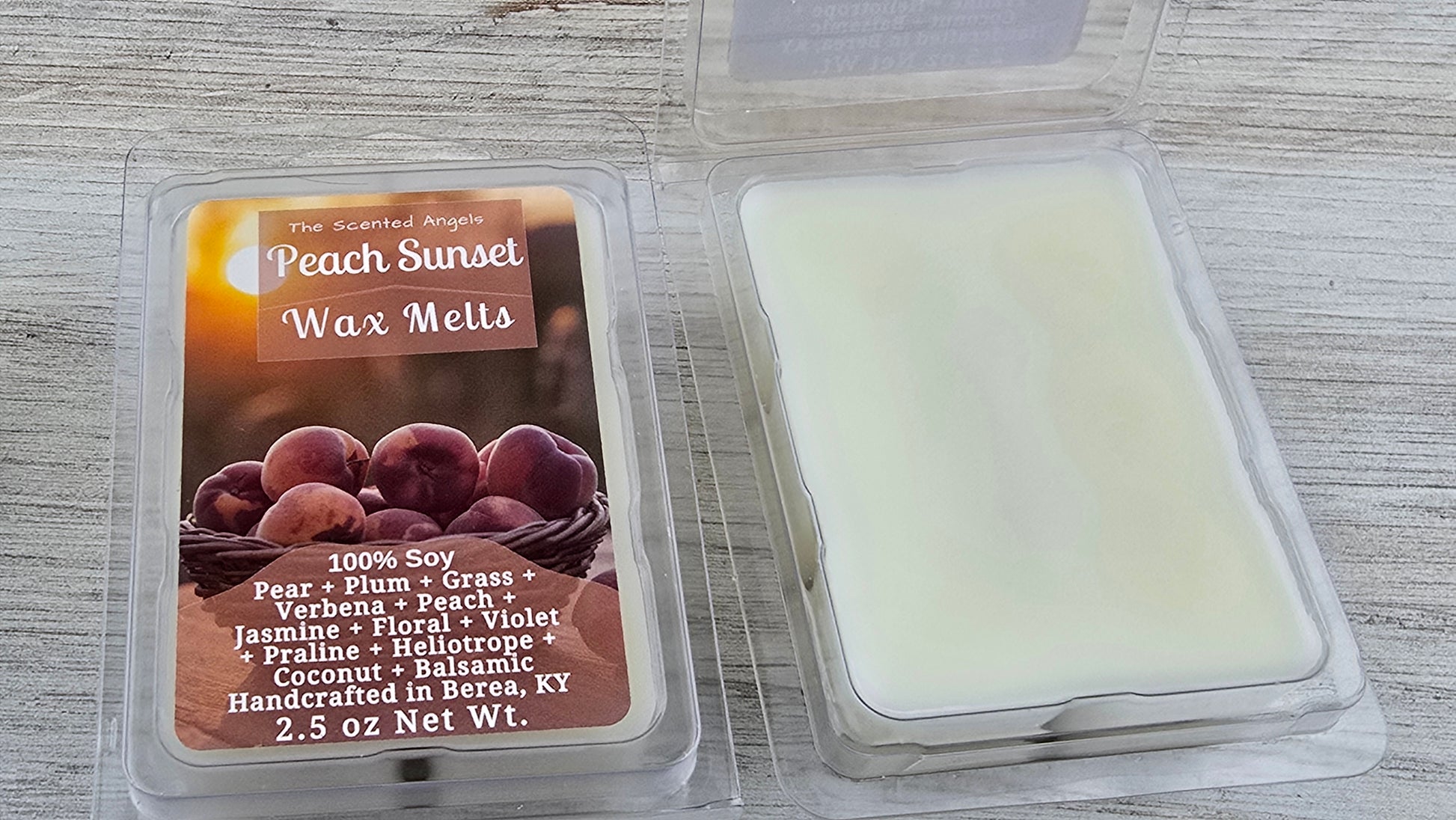 Peach Sunset wax melt packaging with a wax melt inside on a wooden surface