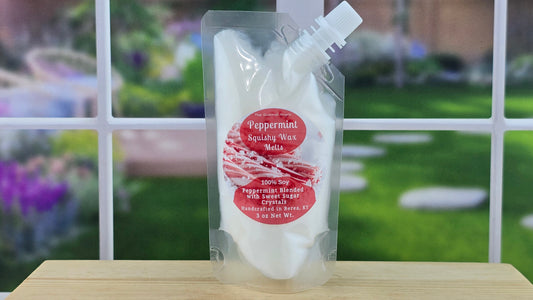 Peppermint squishy was pack on a wooden surface with a garden background