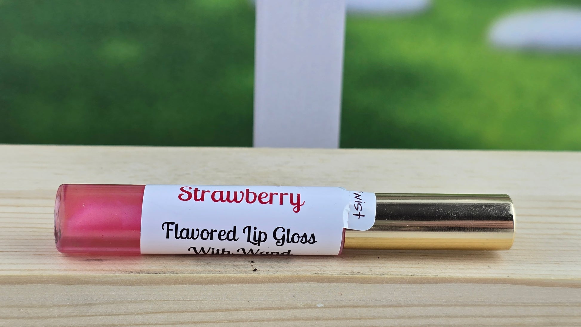 Strawberry flavored lip loss single laying down