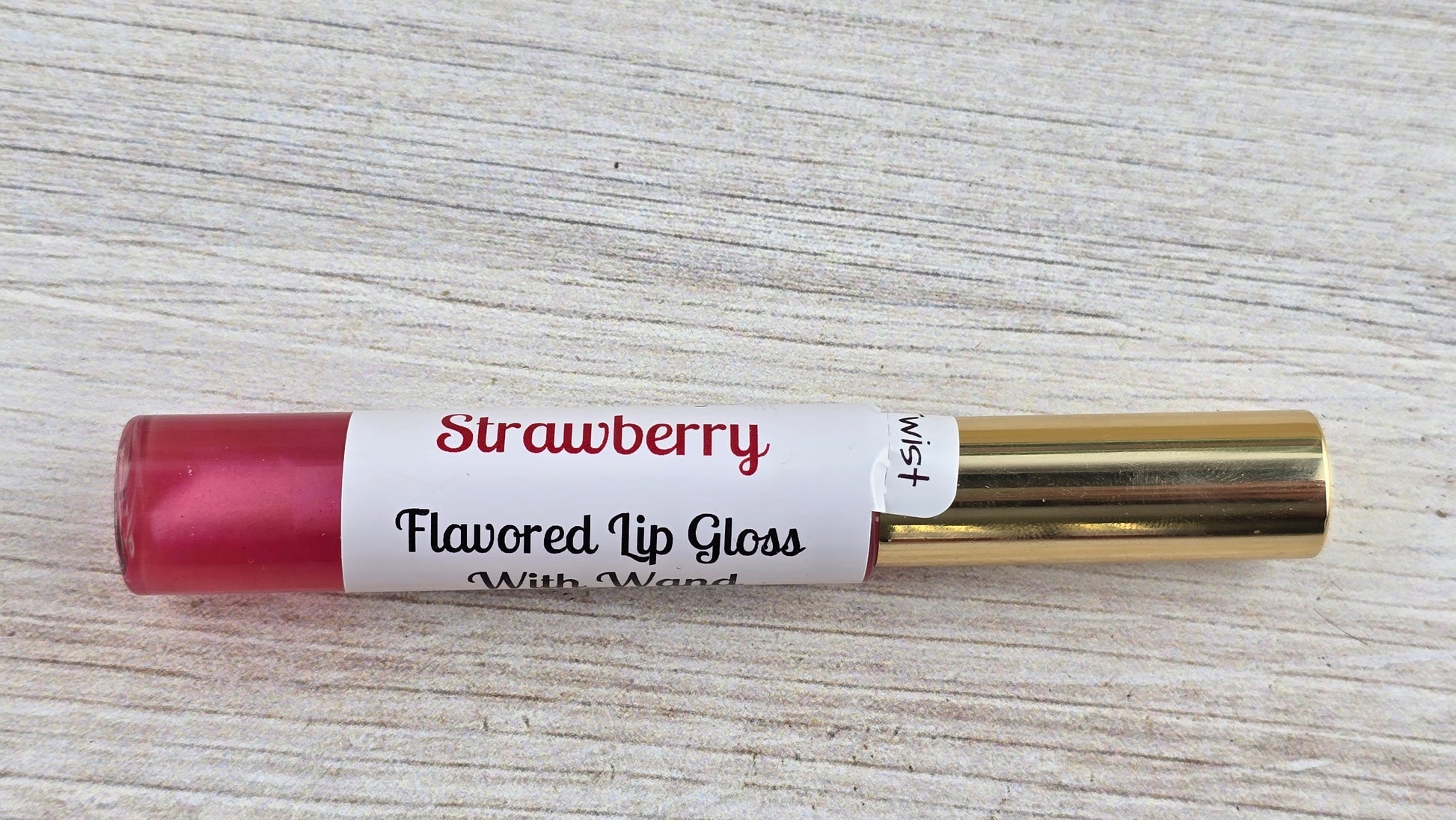 Strawberry flavored lip loss laying down single