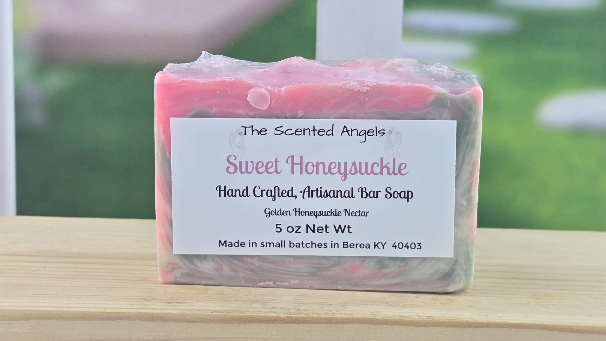 Handcrafted soap bar with a label on a wooden surface