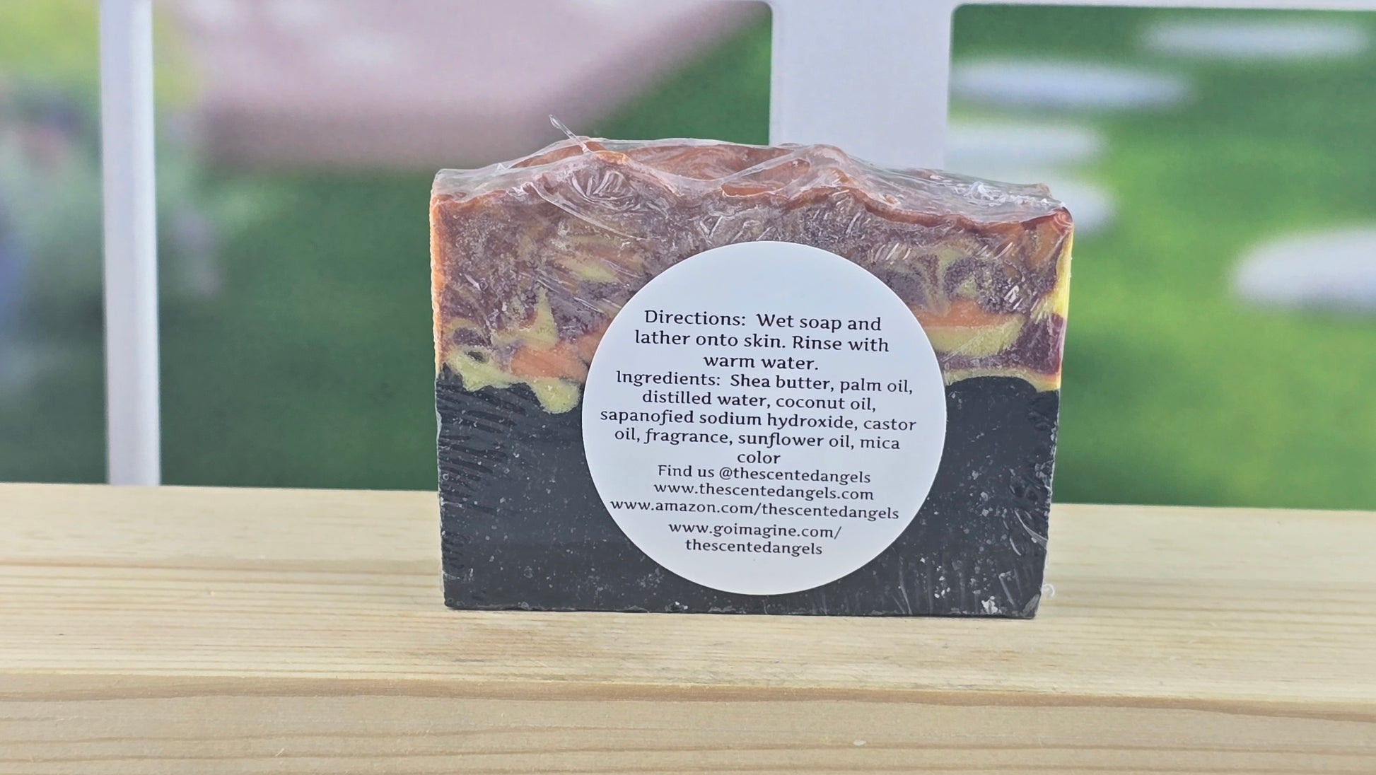 Bar of soap with a label on a wooden surface, blurred background