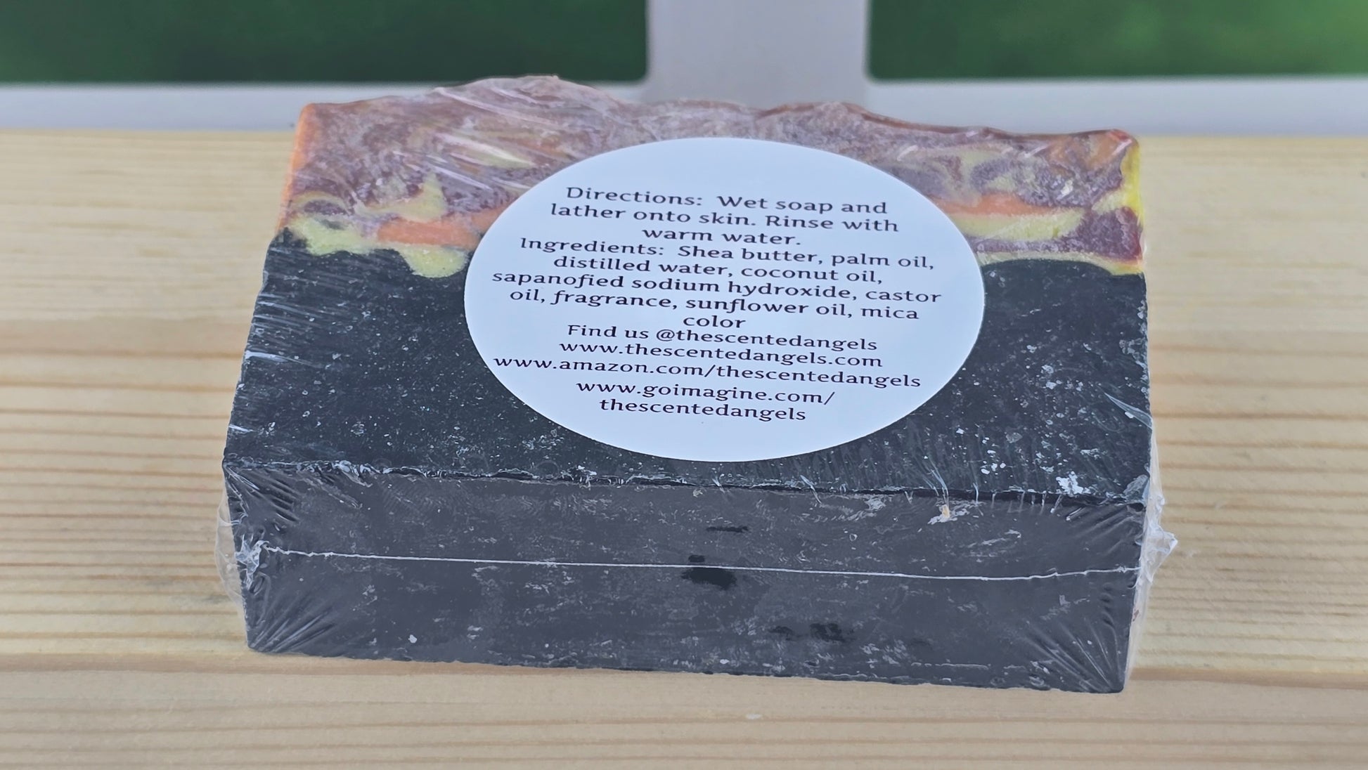 Bar of soap with a label on a wooden surface